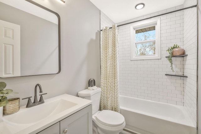 full bathroom with shower / tub combo with curtain, vanity, and toilet