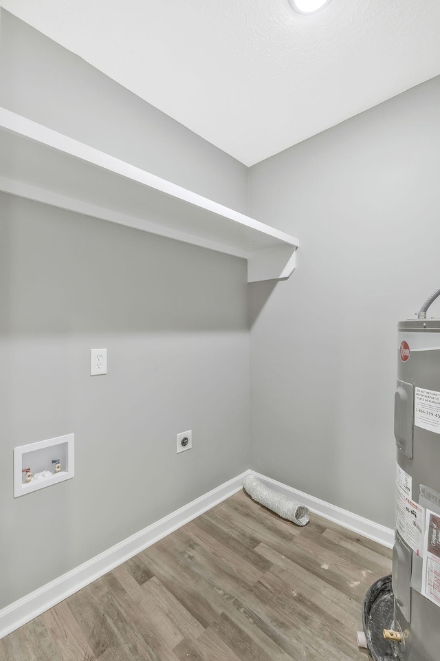 clothes washing area featuring washer hookup, electric water heater, hardwood / wood-style flooring, and hookup for an electric dryer