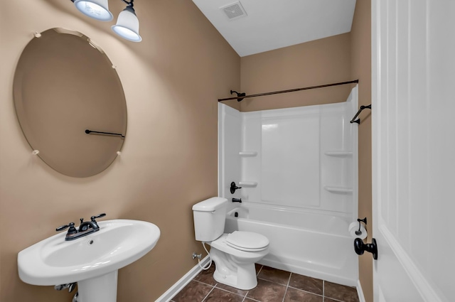 full bathroom featuring tile patterned flooring, sink, washtub / shower combination, and toilet