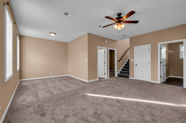 carpeted empty room with ceiling fan