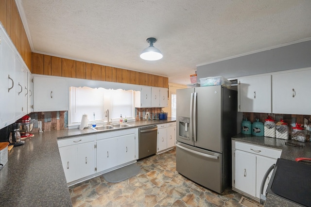 kitchen with white cabinetry, appliances with stainless steel finishes, and sink