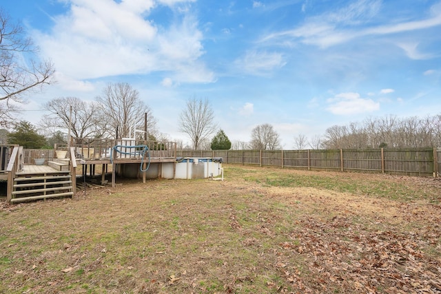 view of yard with a pool side deck