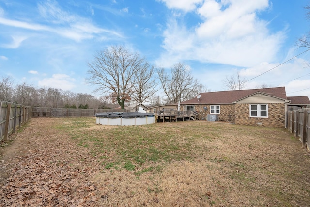 view of yard featuring a swimming pool side deck