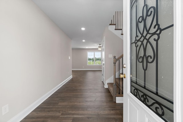 entrance foyer with dark wood-style floors, stairs, baseboards, and recessed lighting