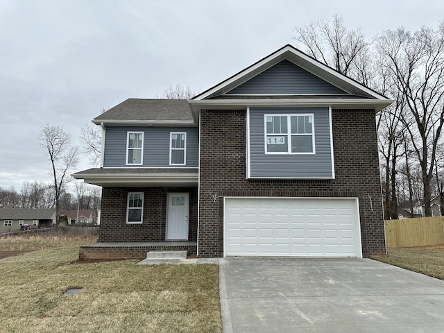 traditional home with driveway, fence, a front lawn, and brick siding