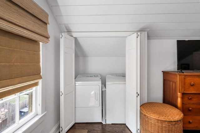 clothes washing area featuring dark hardwood / wood-style floors and independent washer and dryer