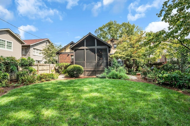 view of yard with a sunroom