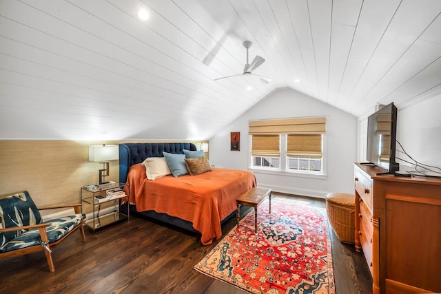 bedroom with vaulted ceiling and dark hardwood / wood-style floors