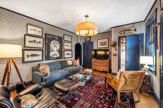 living room featuring hardwood / wood-style floors and ornamental molding