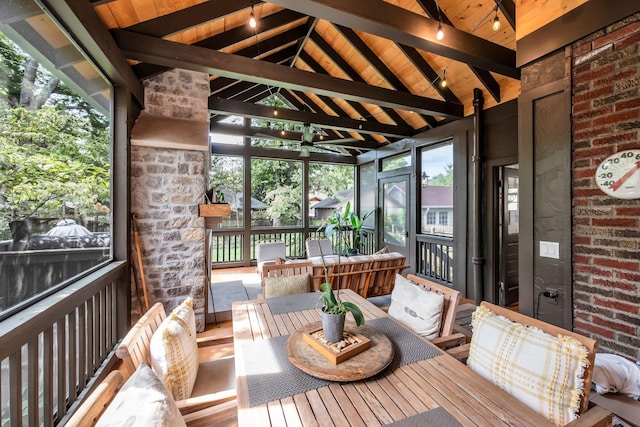 sunroom with wood ceiling and lofted ceiling with beams