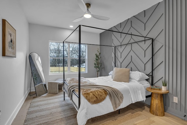 bedroom featuring ceiling fan and light hardwood / wood-style flooring