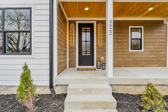 entrance to property featuring a porch