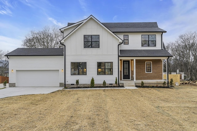 modern inspired farmhouse with a garage, a front yard, and covered porch