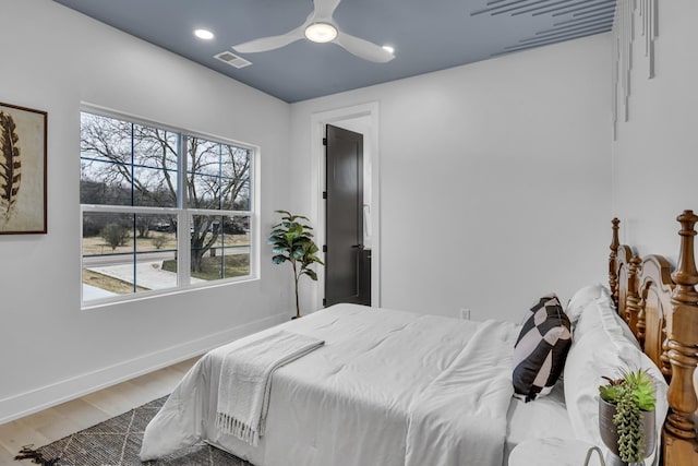 bedroom featuring hardwood / wood-style flooring and ceiling fan