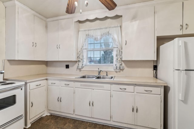 kitchen with sink, white cabinets, and white appliances