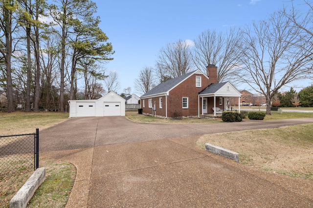 view of front of house with a garage, an outdoor structure, a porch, and a front lawn