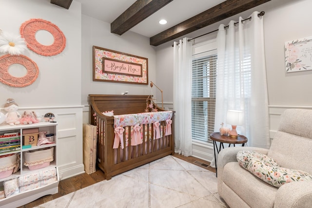 bedroom featuring beam ceiling