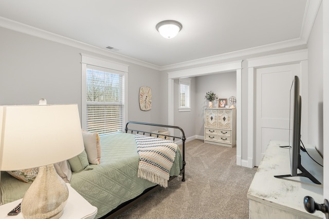 bedroom featuring ornamental molding and carpet floors