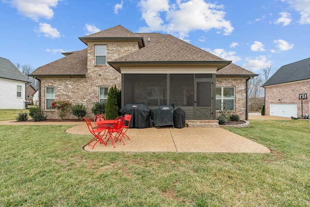 back of property featuring a sunroom, a patio area, and a lawn