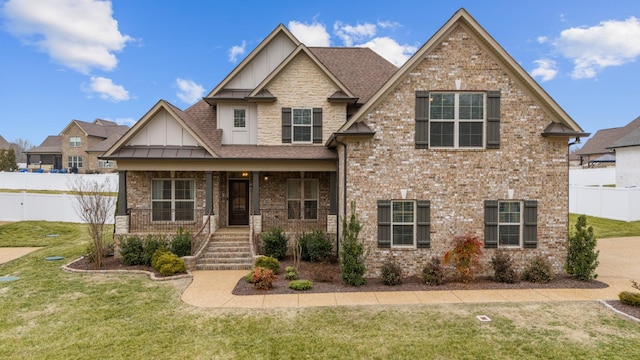 craftsman-style house with a front yard and a porch