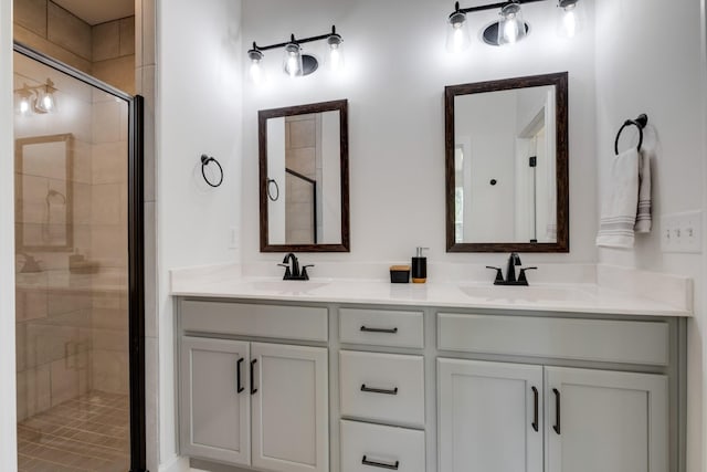 bathroom featuring walk in shower and vanity