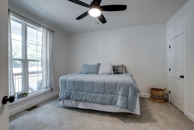 carpeted bedroom featuring ceiling fan