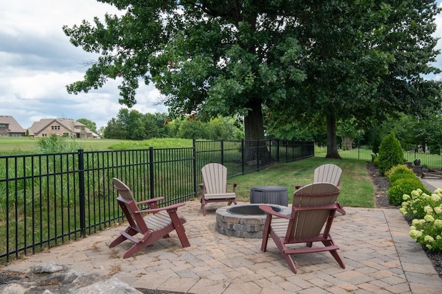 view of patio / terrace featuring an outdoor fire pit