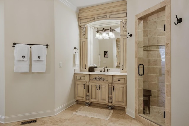 bathroom with tile patterned floors, vanity, and a shower with door