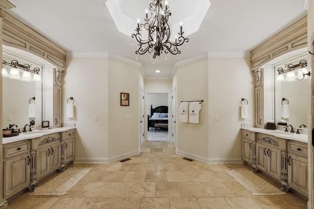 ensuite bathroom featuring ensuite bath, baseboards, two vanities, and ornamental molding