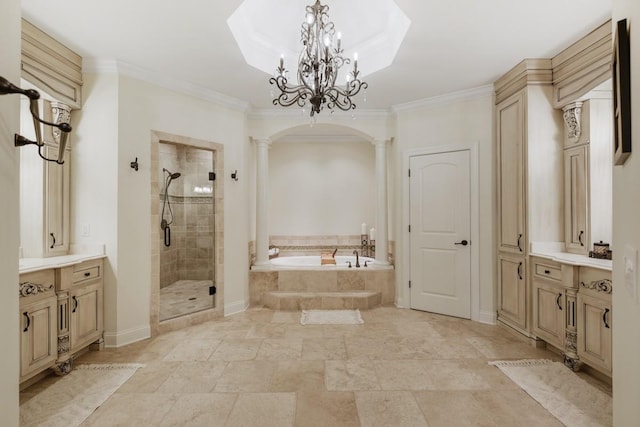 bathroom featuring an inviting chandelier, decorative columns, vanity, ornamental molding, and independent shower and bath