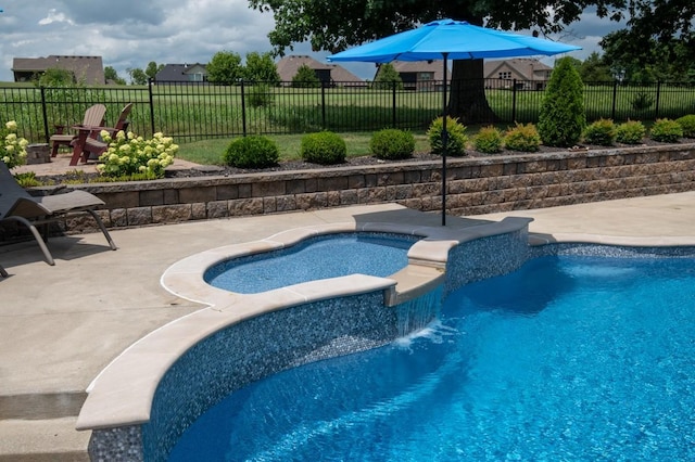 view of pool with a fenced in pool, fence, a patio, and an in ground hot tub