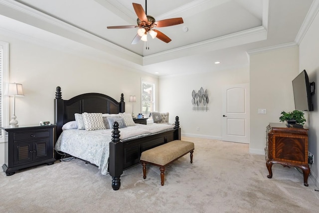 bedroom featuring ornamental molding, light colored carpet, a raised ceiling, and ceiling fan