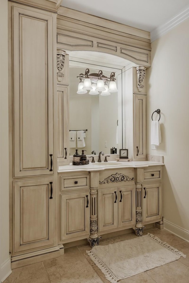 bathroom featuring crown molding and vanity