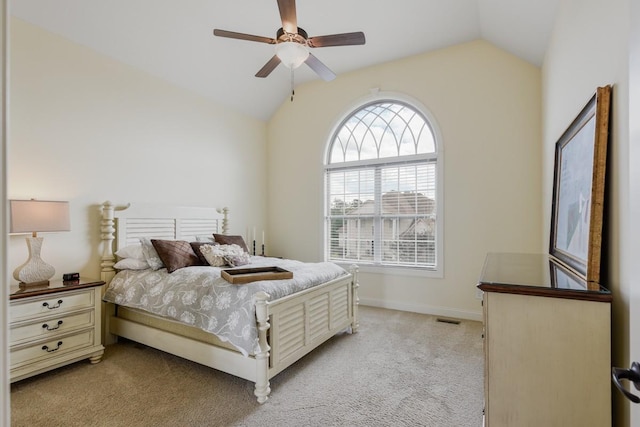 bedroom featuring ceiling fan, lofted ceiling, light carpet, visible vents, and baseboards