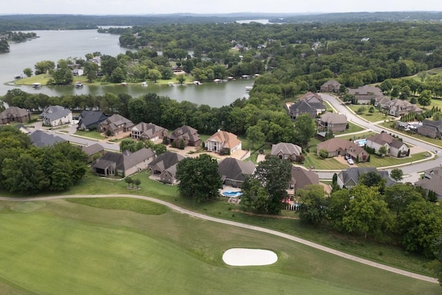 birds eye view of property with a water view, a residential view, and golf course view