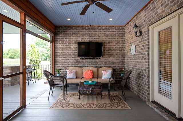 sunroom / solarium with wooden ceiling and ceiling fan