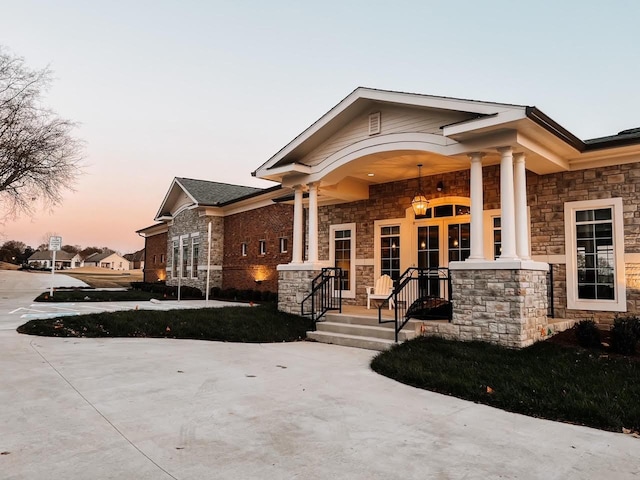 craftsman-style home featuring covered porch