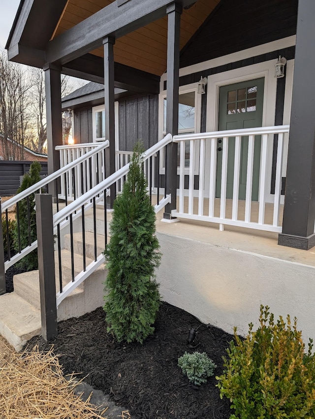 view of exterior entry with a porch