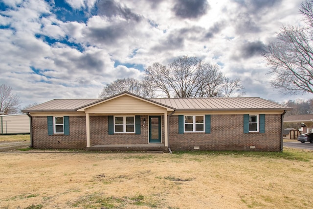 ranch-style home with a front lawn