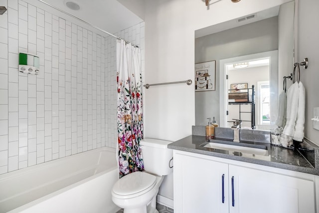 full bathroom with vanity, toilet, and shower / bath combo