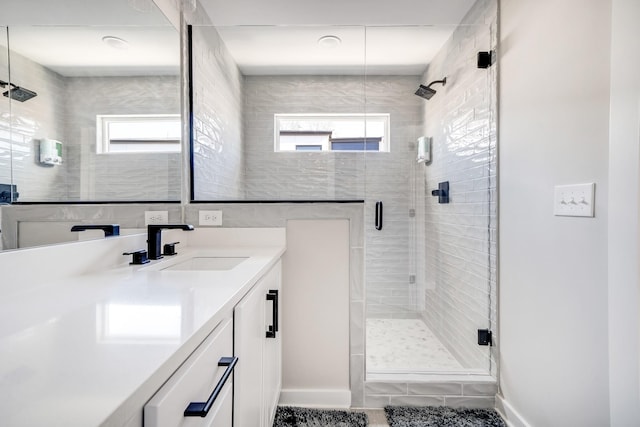 bathroom with vanity and walk in shower