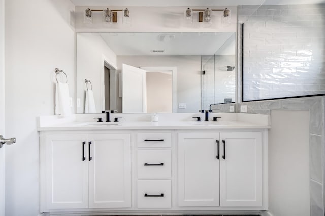 bathroom with vanity and an enclosed shower