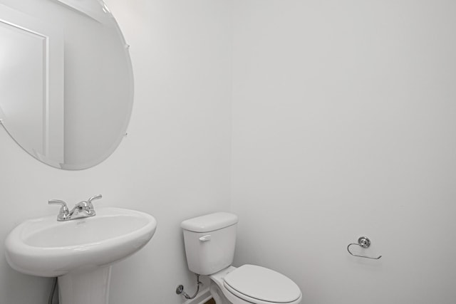 bathroom with sink and toilet