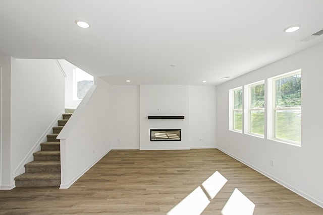 unfurnished living room featuring light wood-type flooring