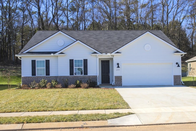 ranch-style home with a garage and a front yard