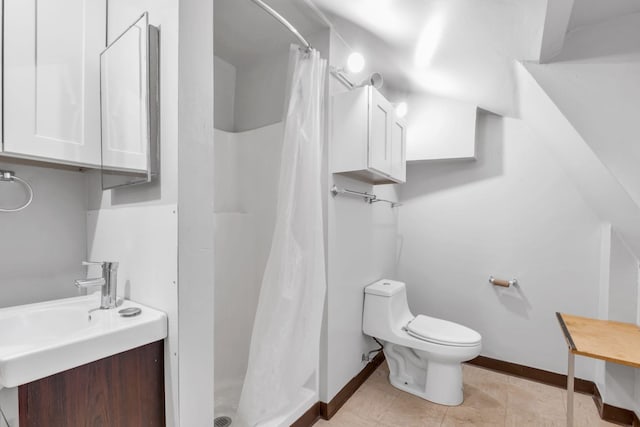 bathroom featuring walk in shower, vanity, tile patterned floors, and toilet