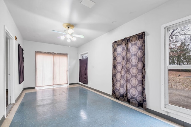 unfurnished room with ceiling fan