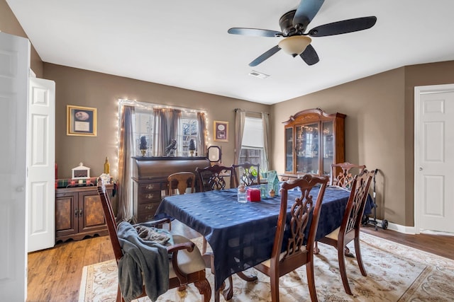 dining area featuring ceiling fan and light hardwood / wood-style flooring