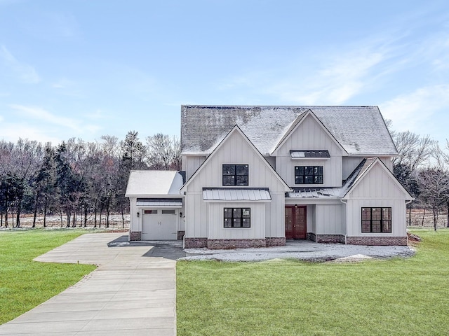 exterior space with a garage, concrete driveway, a yard, and board and batten siding