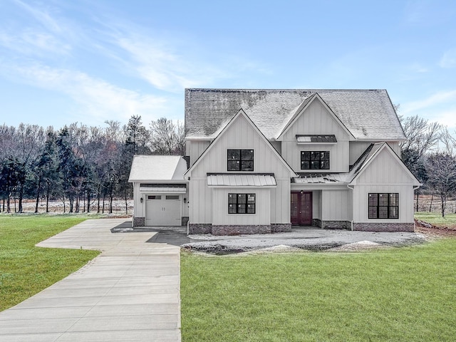 exterior space featuring a standing seam roof, metal roof, driveway, a yard, and board and batten siding